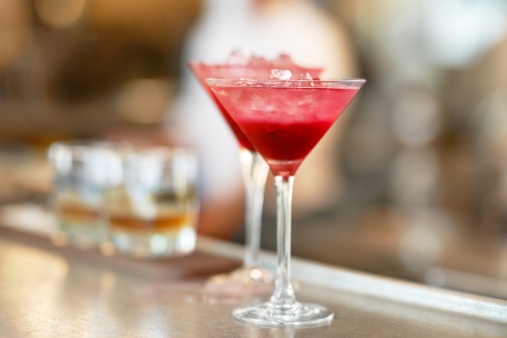 Denmark, Aarhus, Two Martini Glasses standing on a bar counter