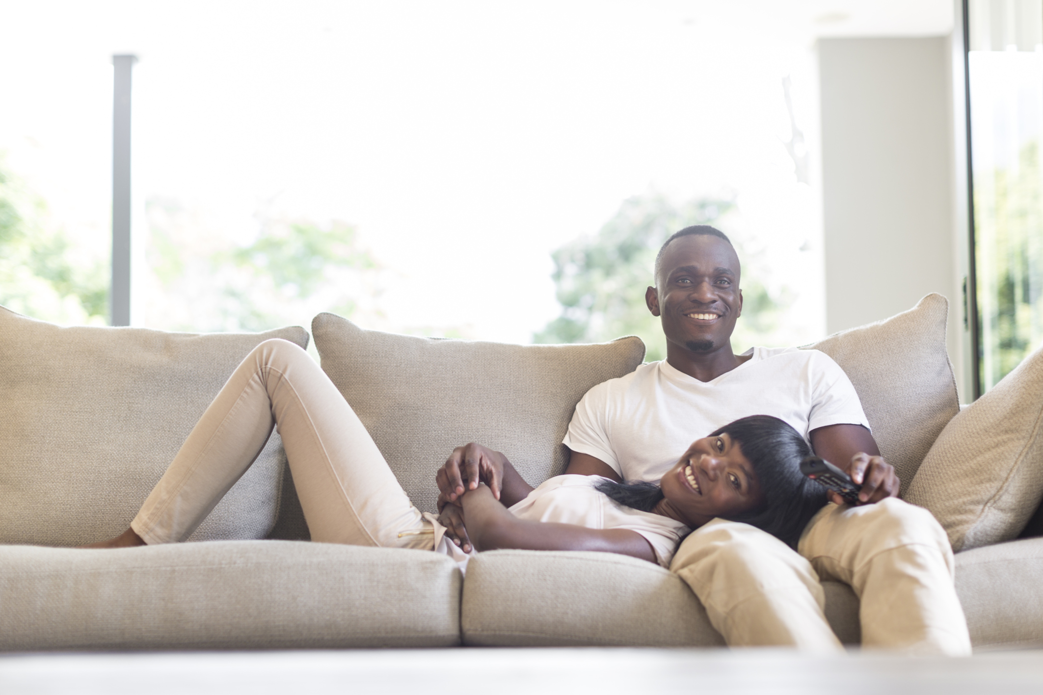 Portrait of couple relaxing on bed, Cape Town, South Africa