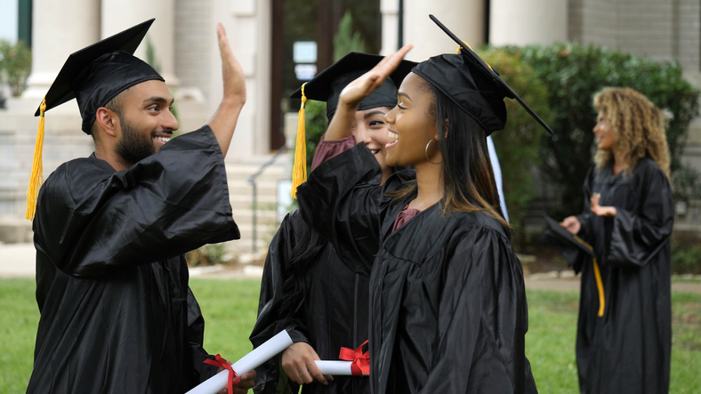 College grads give high five