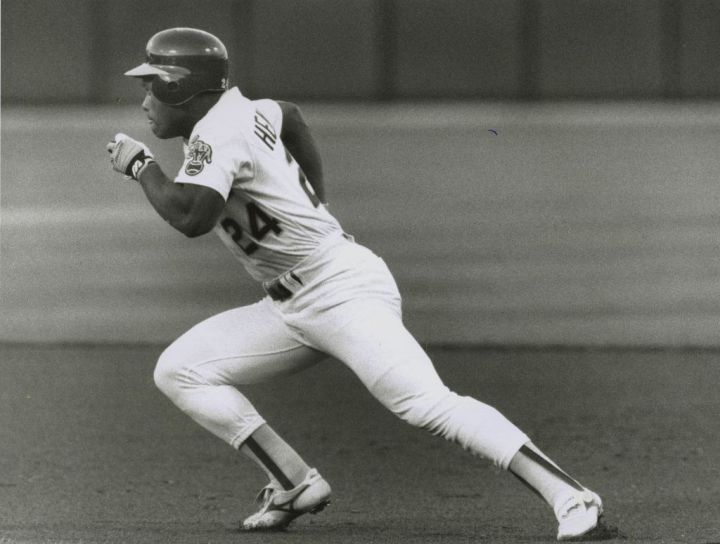 Rickey Henderson, in pursuit of the Major League stolen base record. 1990.